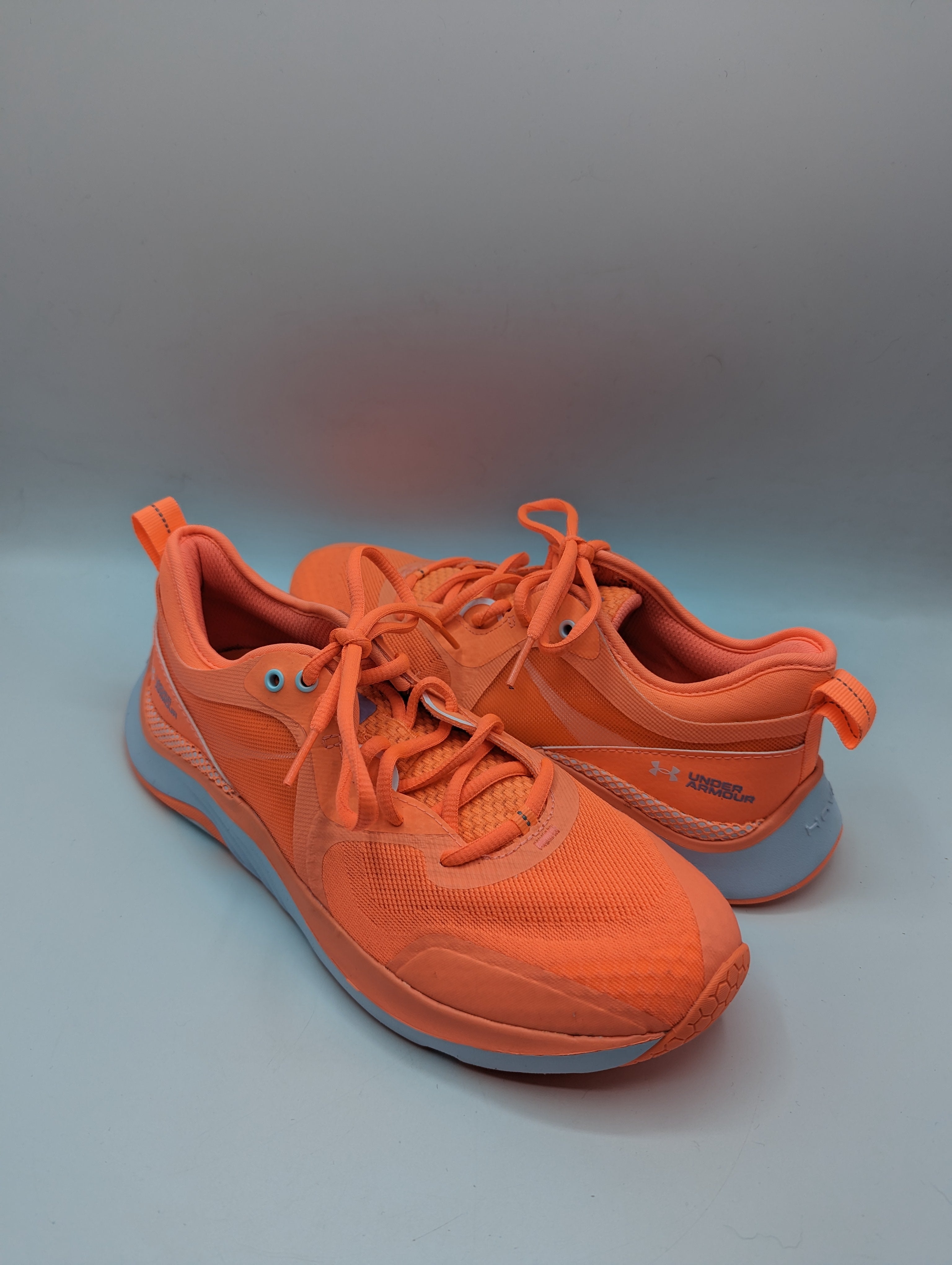 Orange under best sale armour trainers